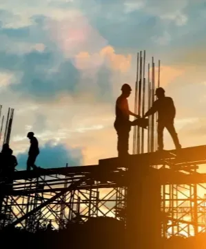 people working on top of scaffolding wearing hard hats 