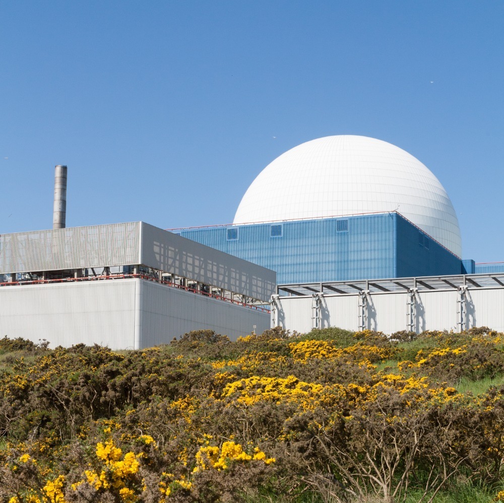 image of a power station, blue sky