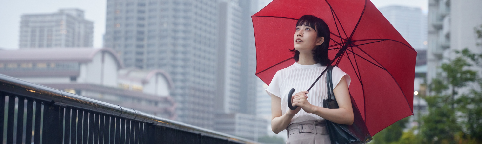 image of a women with an umbrella, symbolic of umbrella contracting